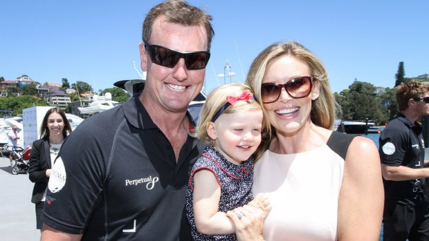 Winning smile after the Sydney to Hobart victory, Anthony Bell and Kelly Landry with daughter Charlize.