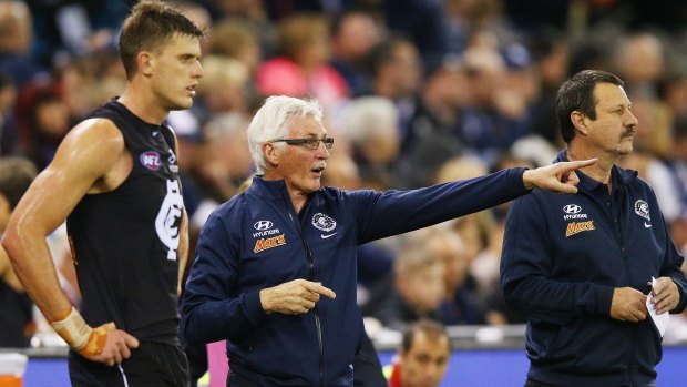 Blues coach Mick Malthouse gives instructions to Cameron Wood during the match against GWS on Saturday.