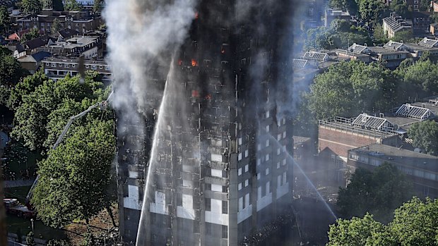 Firefighters tackle the building after a huge fire engulfed the 24-storey Grenfell Tower in Latimer Road, West London. 