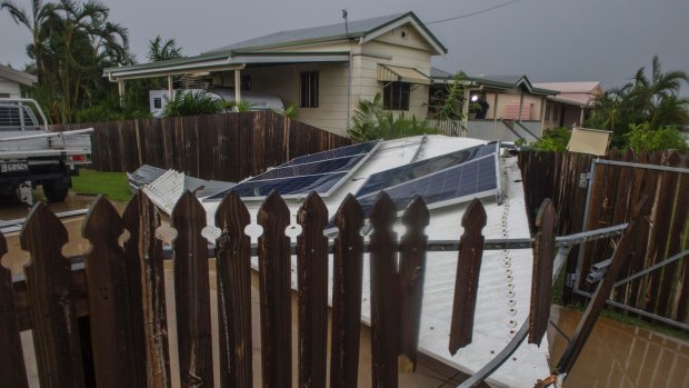 A lost roof lands in the neighbour's garden in Bowen.