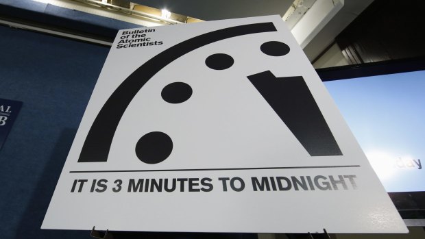 A sign showing the 'Doomsday Clock' that remains at three minutes to midnight is seen after it was unveiled by the Bulletin of the Atomic Scientists on Tuesday. 