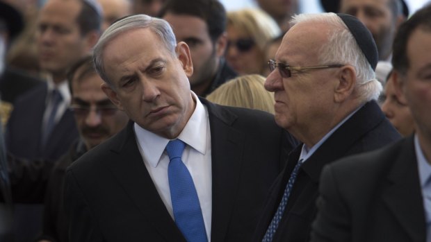 Israeli Prime Minister Benjamin Netanyahu (left) attends the funeral service in Jerusalem of the four Jews killed in an Islamist attack on a Kosher supermarket in Paris last week.