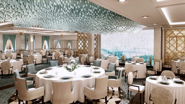 Regent Seven Seas Explorer's Compass Rose restaurant with blue Murano glass chandelier.