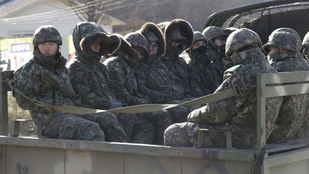 South Korean soldiers ride on a truck in Yeoncheon, south of the demilitarised zone that divides the two Koreas on Friday.