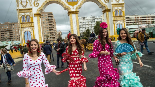 Young women in traditional dress in Seville. Spain is notorious for theft.