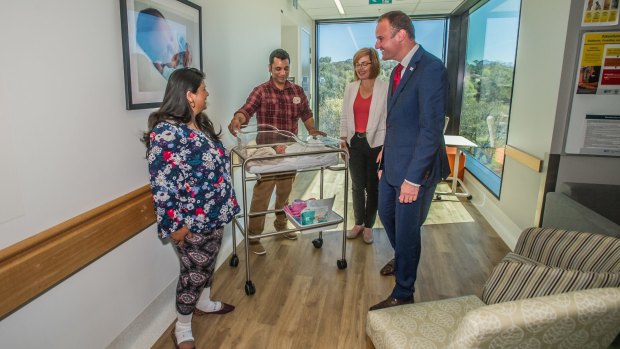 Chief Minister Andrew Barr and new Health Minister Meegan Fitzharris meet newborn Rhianna Khanna and mum Meenal and dad Sachin of Casey at the Centenary Women's and Children's Hospital, during the ACT election campaign.