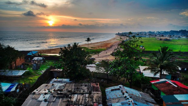 A view of the Atlantic Ocean is seen from the roof of a home in the Capitol Hill area of Monrovia, Liberia.