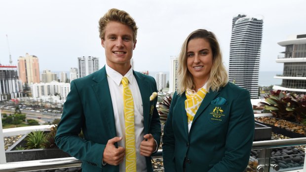 Swimmer Britany Elmslie (right) and triathlete Matt Hauser in the Commonwealth Games uniforms on the Gold Coast.