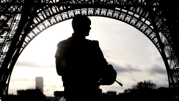 A soldier stands guard at the Eiffel Tower in Paris as France reels from a spate of suicide attacks and killings.