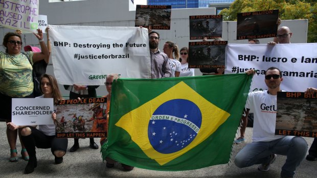 Greenpeace and Get Up activists protest outside the international Annual General Meeting of BHP Billiton in Perth.