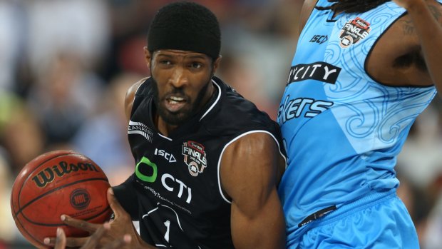 Melbourne United's Hakim Warrick tries to drive past New Zealand's Charles Jackson. 