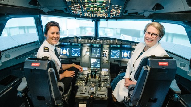 Aviation student Eliza Terry and Vice-Chancellor Professor Geraldine Mackenzie in the University of Southern Queensland's new Airbus A320 flight simulator.