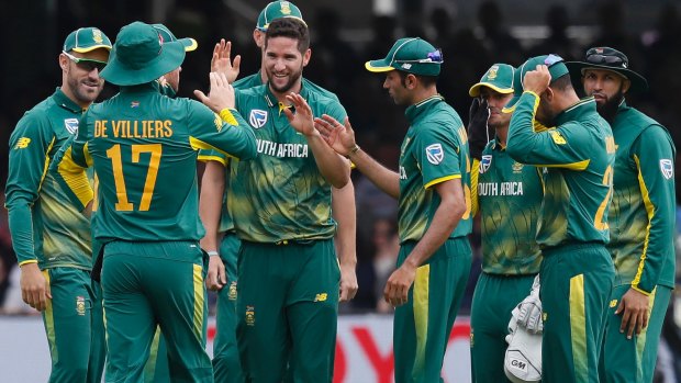 South Africa's Wayne Parnell celebrates taking the wicket of England's Eoin Morgan.
