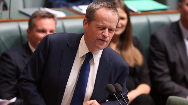 Opposition Leader Bill Shorten winks at Malcolm Turnbull while seeking to move a motion of no confidence in Prime Minister Tony Abbott during question time. 