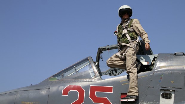 A Russian army pilot poses on the cockpit of SU-25M jet fighter. Russia has insisted its air strikes are targeting Islamic State and al-Qaeda's Syrian affiliates.