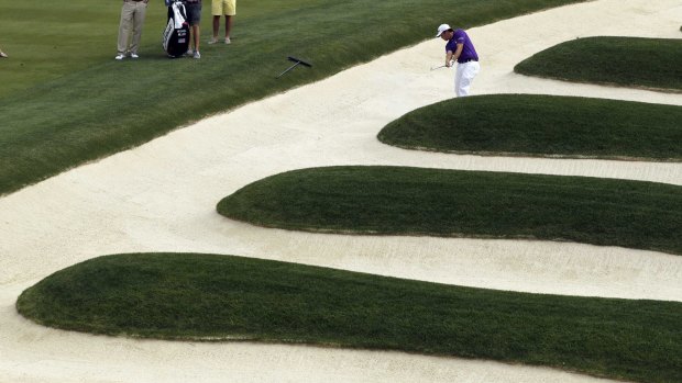 Mike Miller hits out of the bunker at the 'church pews' at Oakmont.