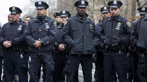 New York police officers observe a moment of silence.