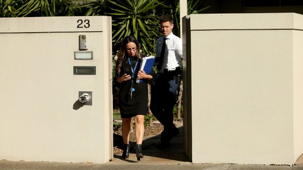 Police leave the Ristevski family home on Tuesday. 