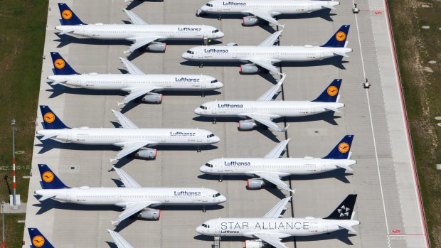 Lufthansa planes sitting on the tarmac at the Berlin Brandenburg International Airport.