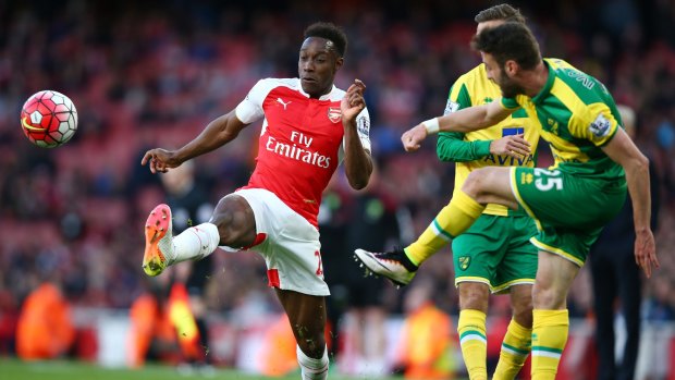 There it is: Danny Welbeck challenges Ivo Pinto during the Premier League match between Arsenal and Norwich City at The Emirates Stadium.