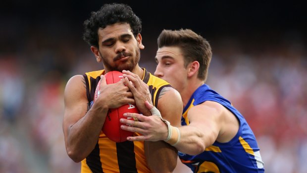 Elliot Yeo fails to stop Cyril Rioli from taking a mark.