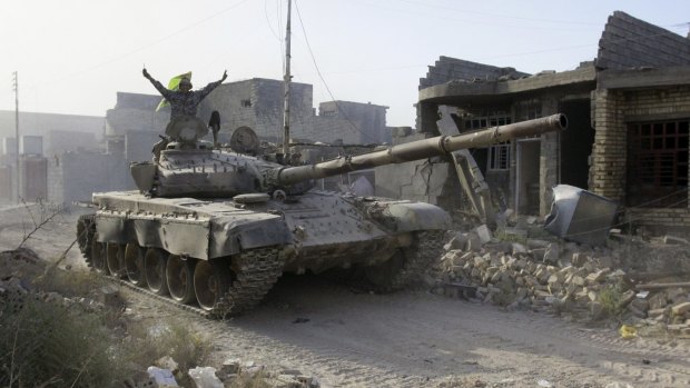 An Iraqi forces tank moves into Fallujah, Iraq. 