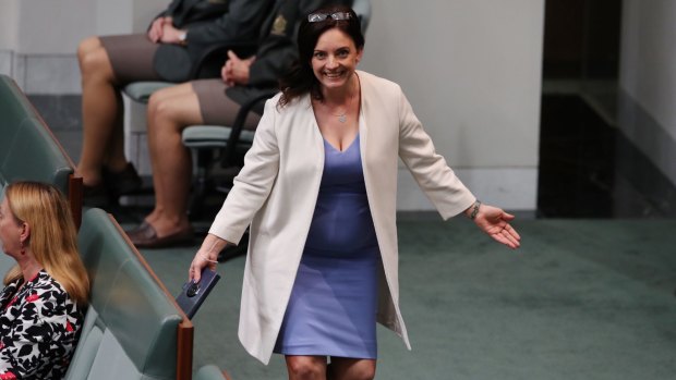 Labor MP Emma Husar celebrates not being ejected from question time.