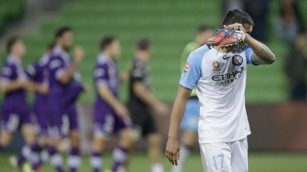 Tim Cahill heads off after Melbourne City lost to Perth Glory.