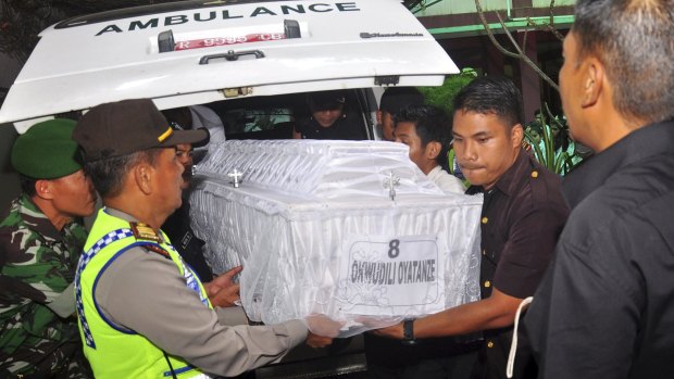 Members of Indonesian security carry the coffin containing the body of executed Nigerian Okwudili Oyatanze at an orphanage in Central Java.