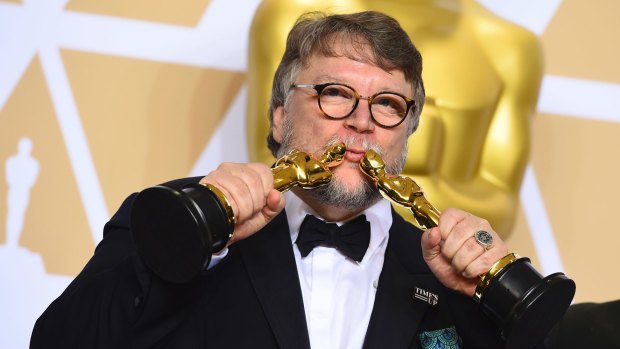 Guillermo del Toro with the Oscars for best director and best picture for <i>The Shape of Water</i>.