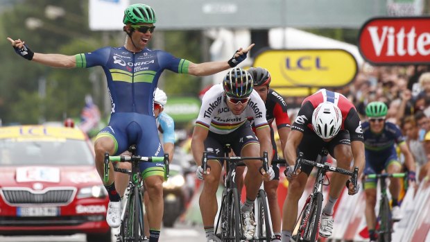 Australia's Michael Matthews (left) celebrates as he crosses the finish line head of Peter Sagan of Slovakia, (centre) and Norway's Edvald Boasson Hagen (right) to win the tenth stage.