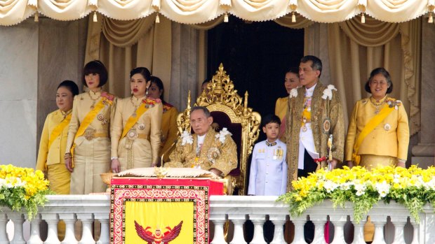 The late king is flanked by his family, including then Crown Prince Maha Vajiralongkorn, second from right, and Princess Maha Chakri Sirindhorn, first right, in December 2012.