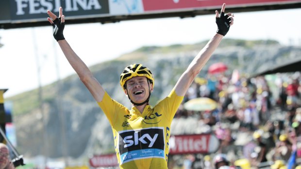 Pushed through the pain ... Britain's Christopher Froome, wearing the overall leader's yellow jersey, celebrates as he crosses the finish line to win the 167-km tenth stage of the Tour de France in La Pierre-Saint-Martin.