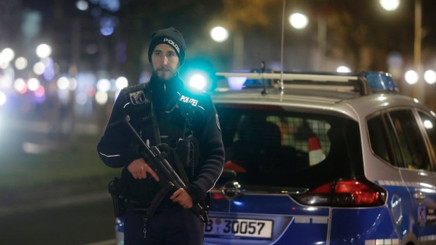 A police officer stands guard after a truck ran into a crowded Christmas market in Berlin.