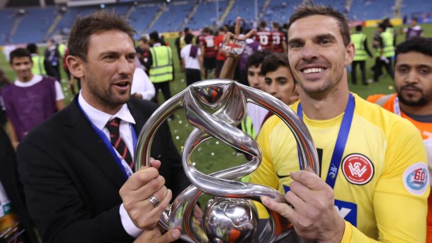 Proud moment: Wanderers coach Tony Popovic and Ante Covic after the Asian Champions League final win against Saudi Arabia's Al Hilal.