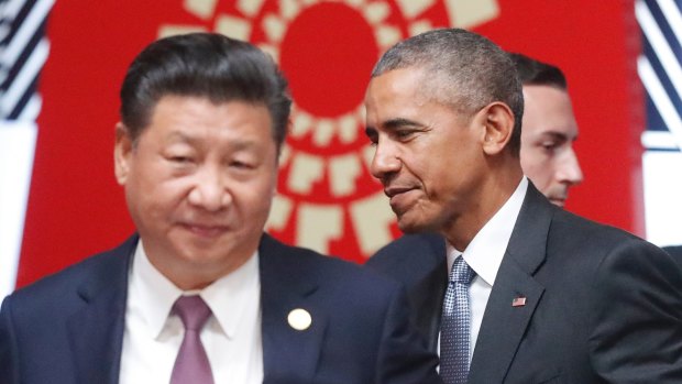 Changing of the guard: Xi Jinping and Barack Obama pass each other at the APEC summit's opening session in Lima.