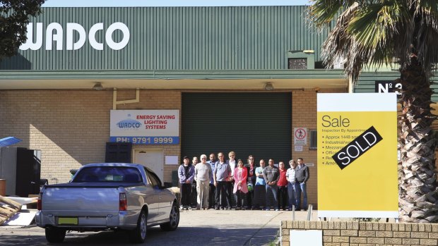 Employees outside Wadco Lighting, Condell Park, after being retrenched without notice, 2015. 