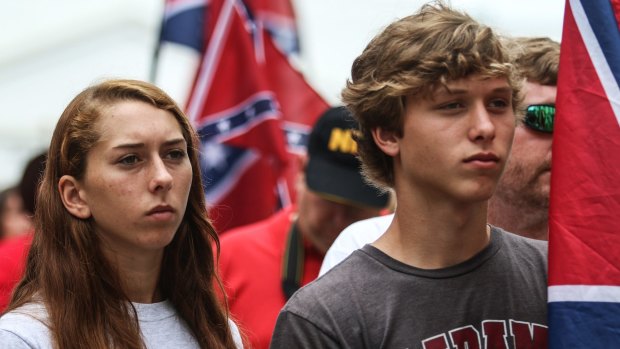 Ashlynn McKeown, left, and her brother Daniel McKeown, of Georgiana, Alabama, at a rally held by members of several Southern heritage organisations who oppose the recent removal of Confederate flags from a monument honouring Confederate Civil War soldiers.