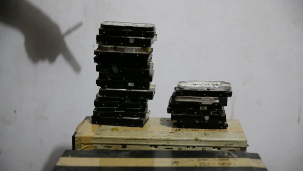 Computer hard drives gathered by members of the Philippines' National Bureau of Investigation anti-human trafficking division during a raid at Deakin's residence.