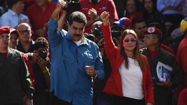 Venezuelan President Nicolas Maduro and his wife Cilia Flores at a rally on Tuesday.