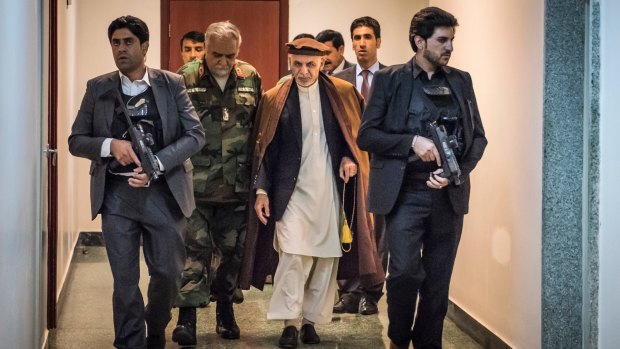 Afghan President Ashraf Ghani with staff and bodyguards at Dawood National Military Hospital in Kabul in June.