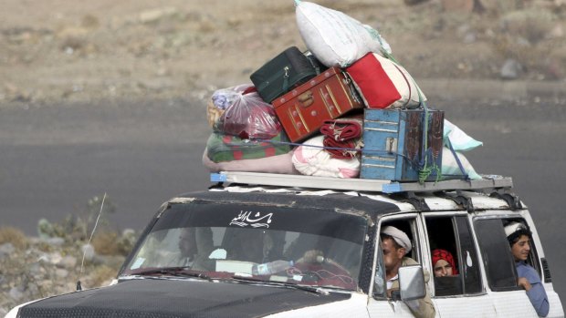 People flee the Yemeni capital Sanaa with their belongings fearing renewed air strikes.