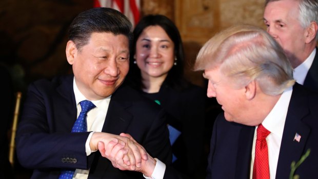 President Trump shakes hands with Chinese President Xi Jinping during a dinner at Mar-a-Lago.