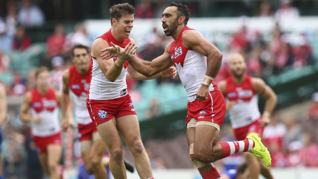 Sydney's Adam Goodes celebrates with Craig Bird after kicking a goal against the Bulldogs. 