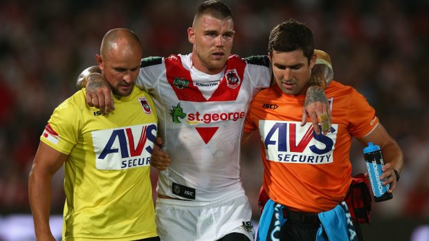 Ankle problem: Dragons fullback Josh Dugan is helped from the field in round one.