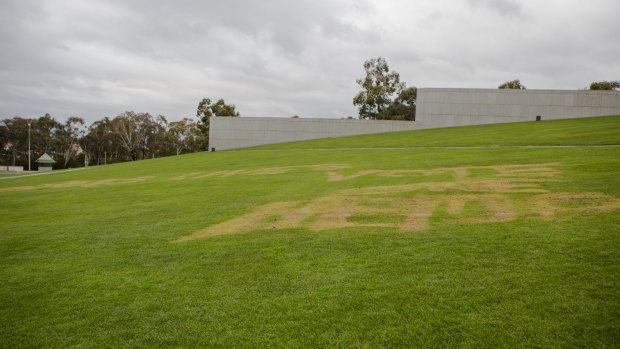 Word burnt into the lawns of Parliament House in July.