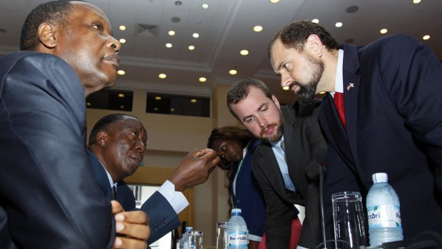 Former Burundian presidents Pierre Buyoya, left, and Sylvestre Ntibantunganya with US special envoy Tom Perriello, right, at talks between Burundi's factions and government in Uganda this week.