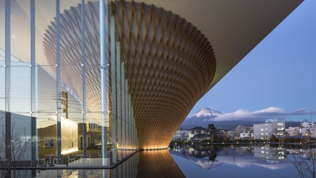 Inside the latticework cone, a white 193-metre spiral ramp simulates the experience of climbing Mount Fuji.