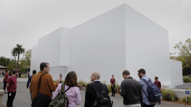 Attendees wait outside the mysterious white building at the Flint Centre in Cupertino.