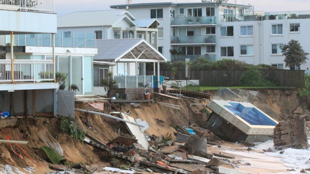 The Collaroy homes, including Mr Silk's at left, and the smashed pool, in the immediate wake of the storm.